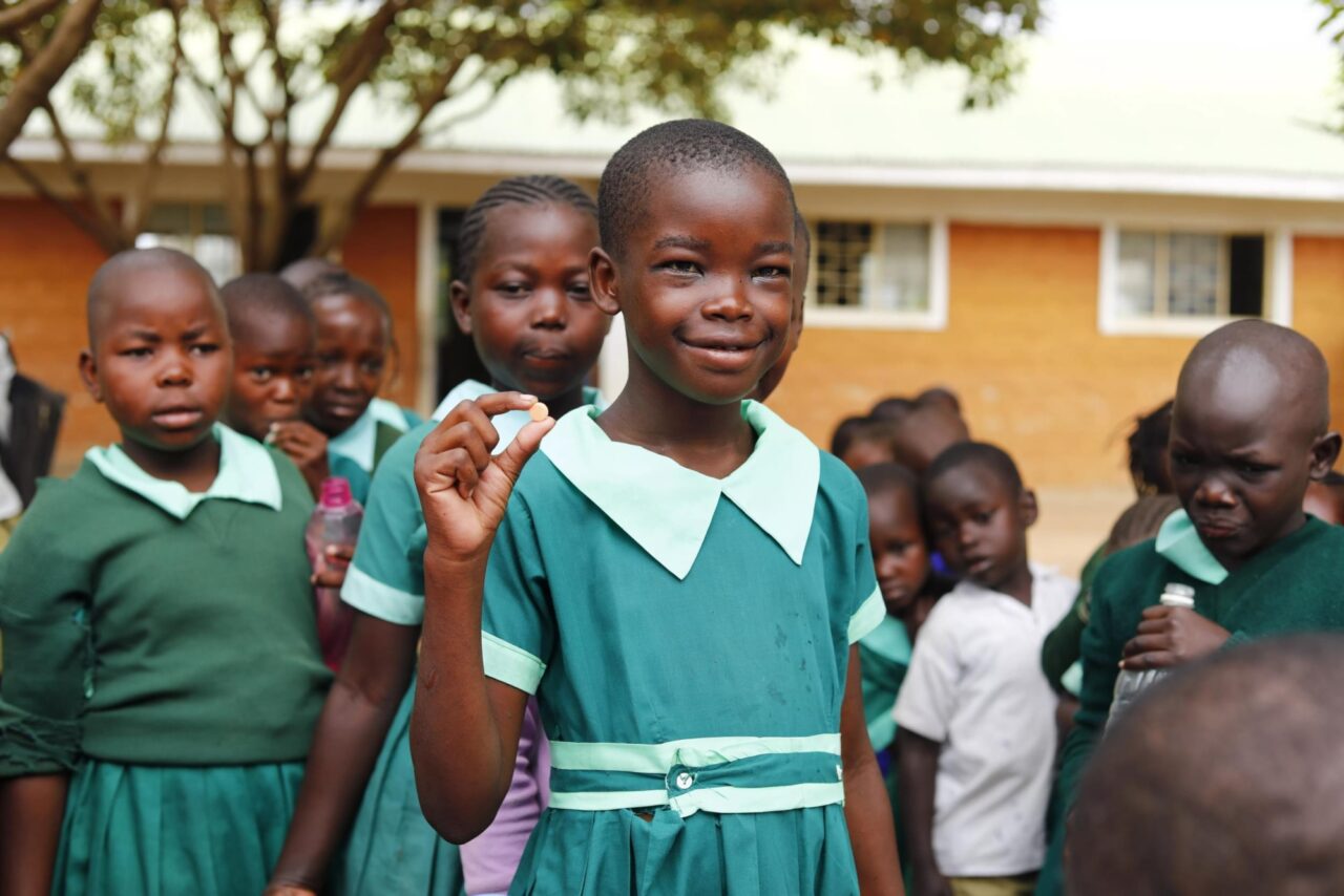 Girl deworming pill