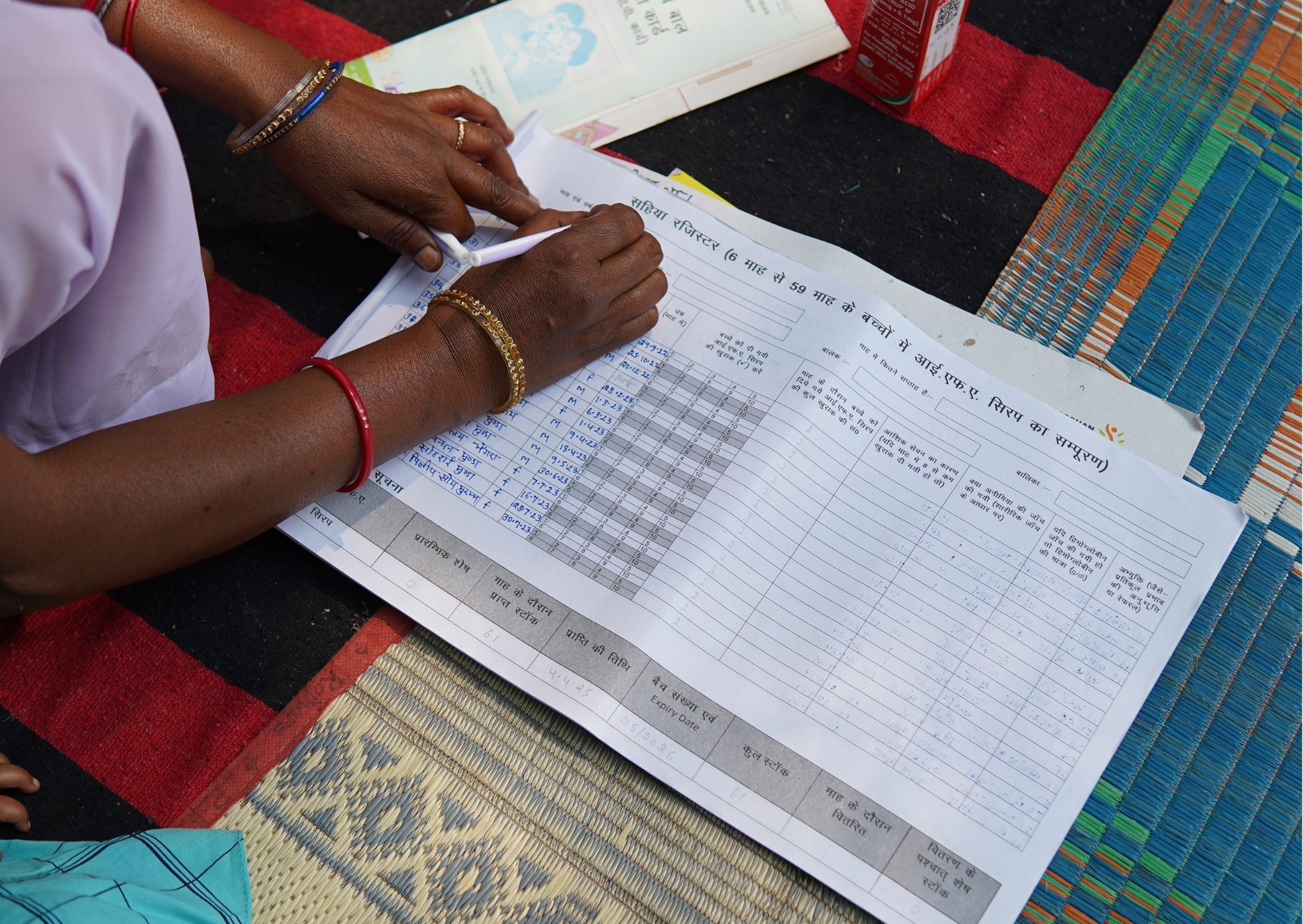 Sarita keeps careful records of every child receiving IFA syrup — data that feeds into district and state-level monitoring systems